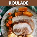 A plate with 2 slices of turkey breast stuffed with sausage meat and roasted vegetables.