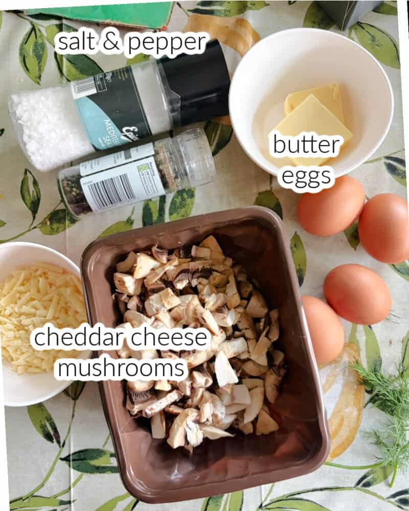 Ingredients used to make omelette with mushrooms and cheddar cheese.