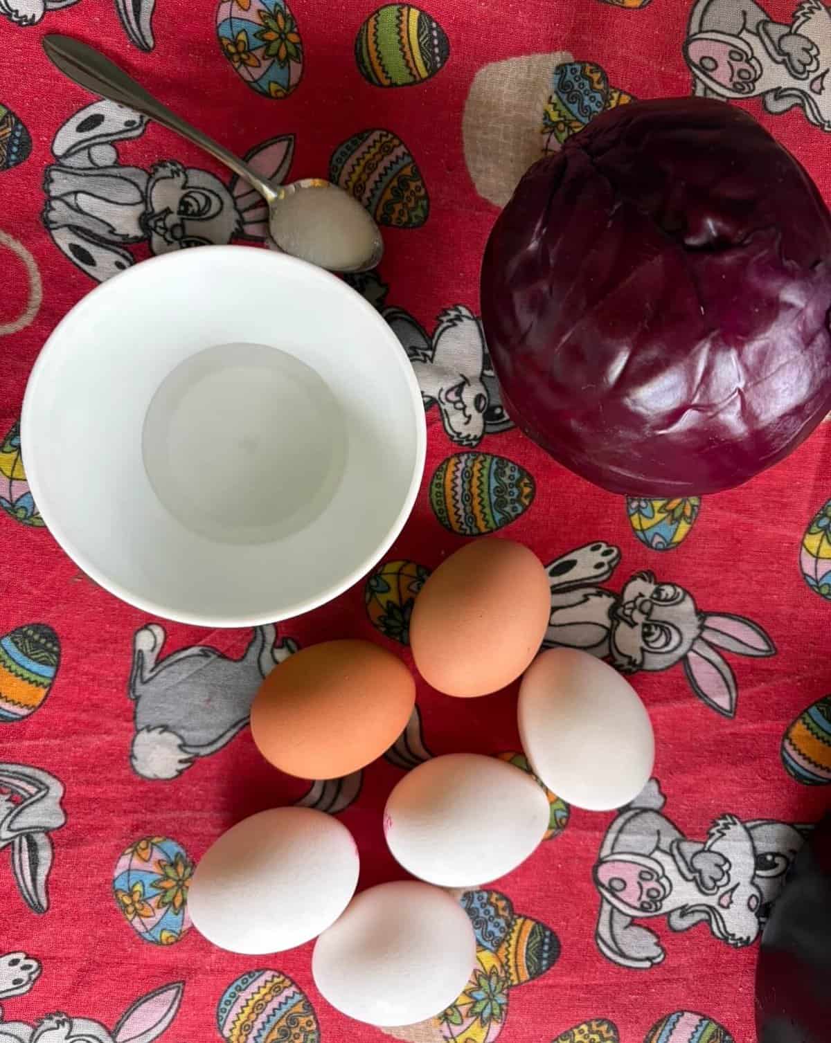 Ingredients displayed on the table for dying eggs.