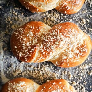A tray with 3 pastries topped with finely chopped walnuts.