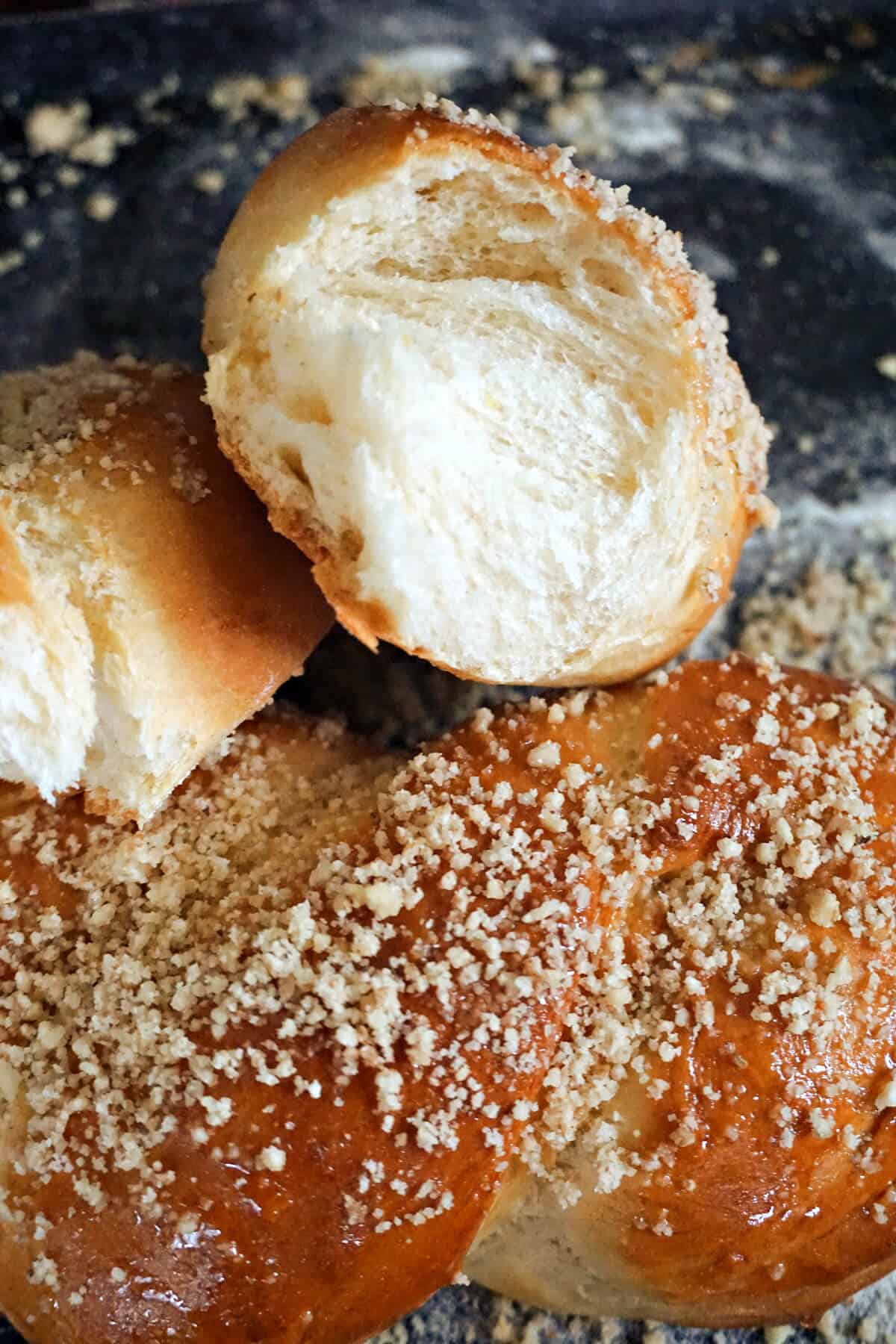 2 halves of a pastry sitting on top of a whole pastry.