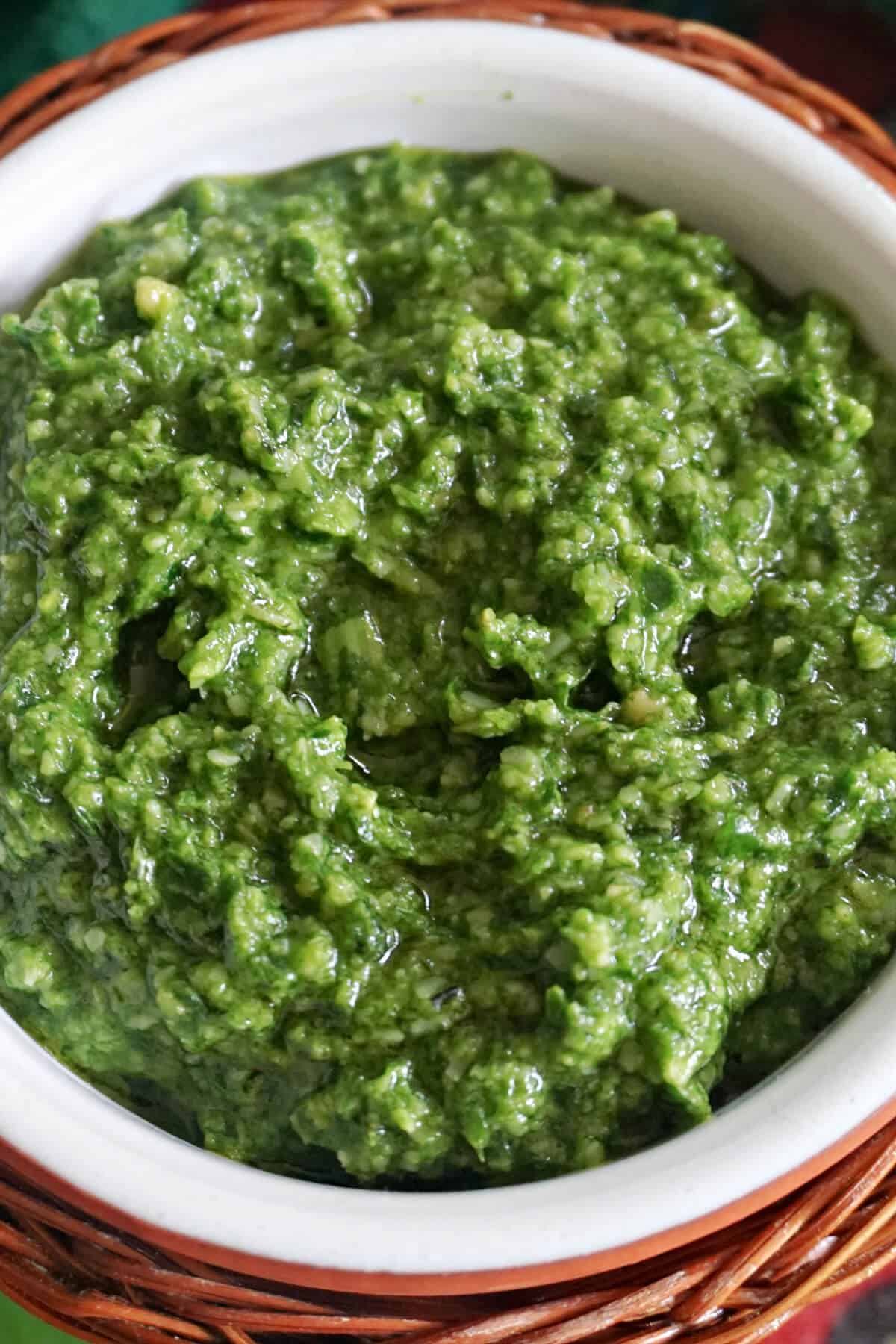 Close-up of a ramekin with pesto.