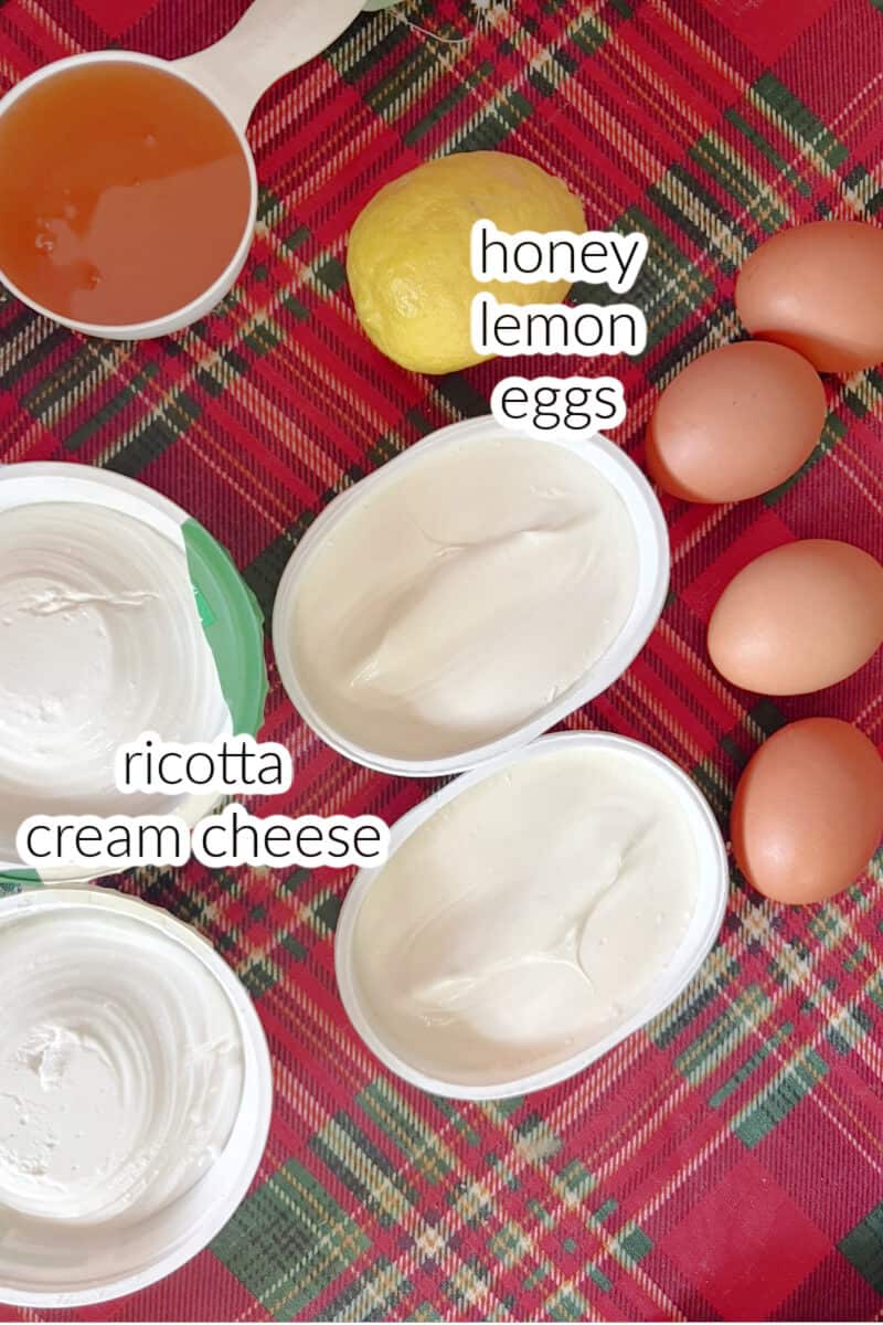 Ingredients displayed on a table for making cheesecake.