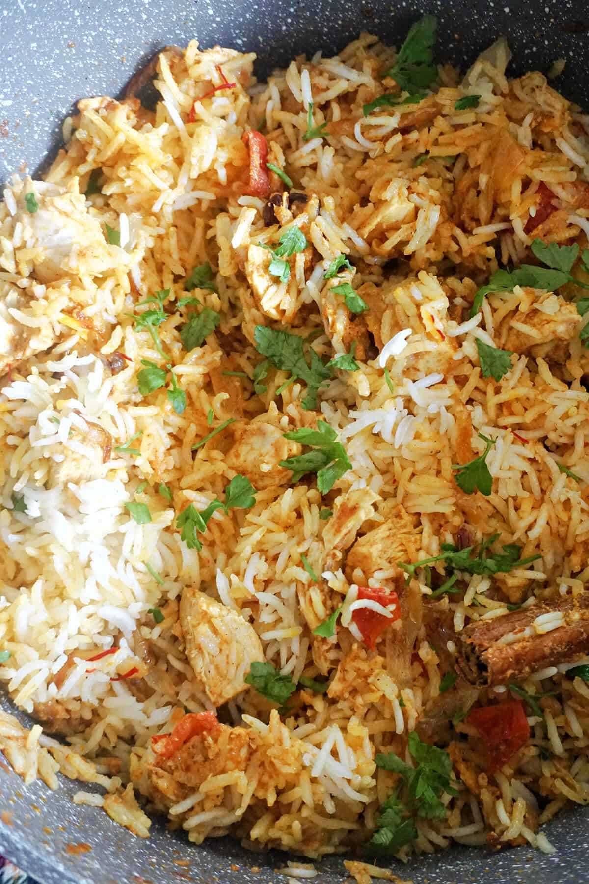 Close-up of a chicken biryani in a pot.