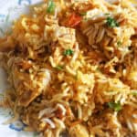 A plate with a portion of chicken biryani.