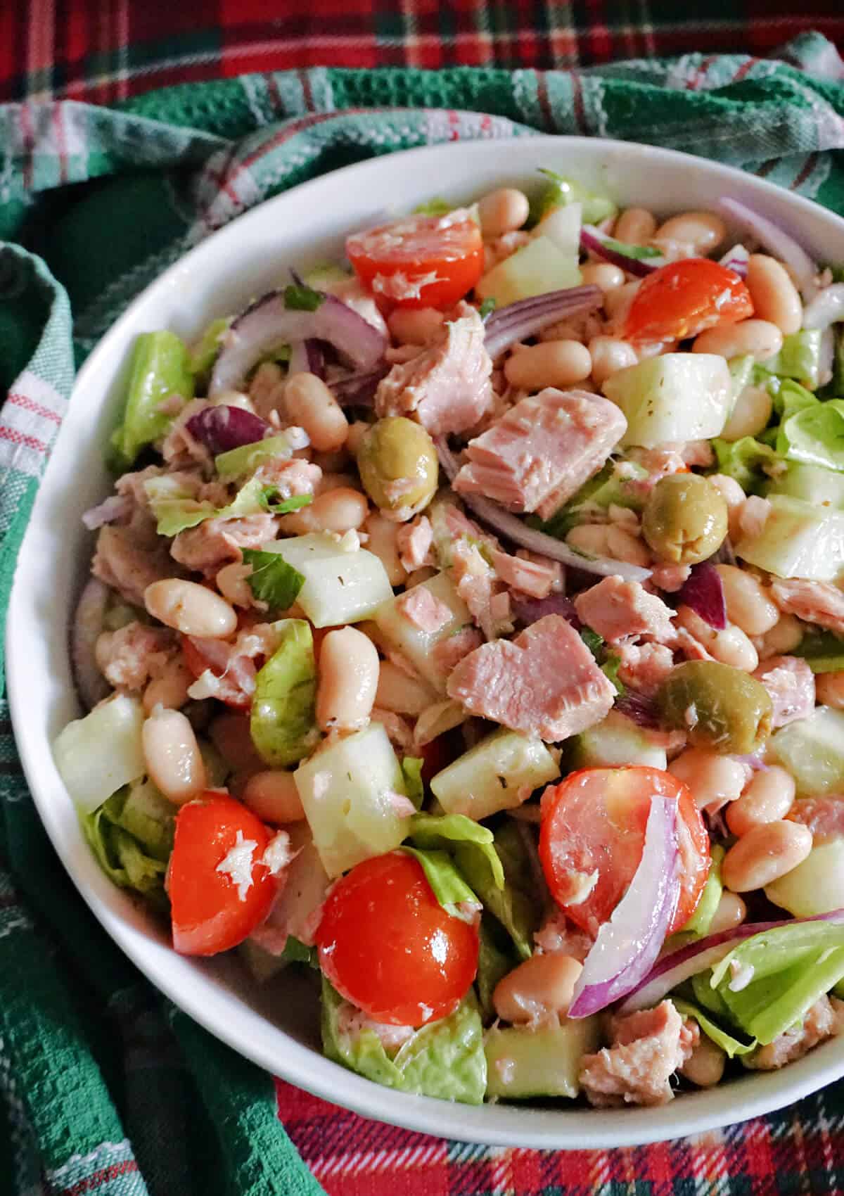 A white bowl of tuna and bean salad.