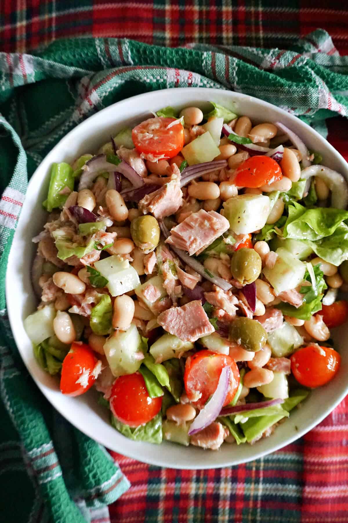 A white bowl with salad.