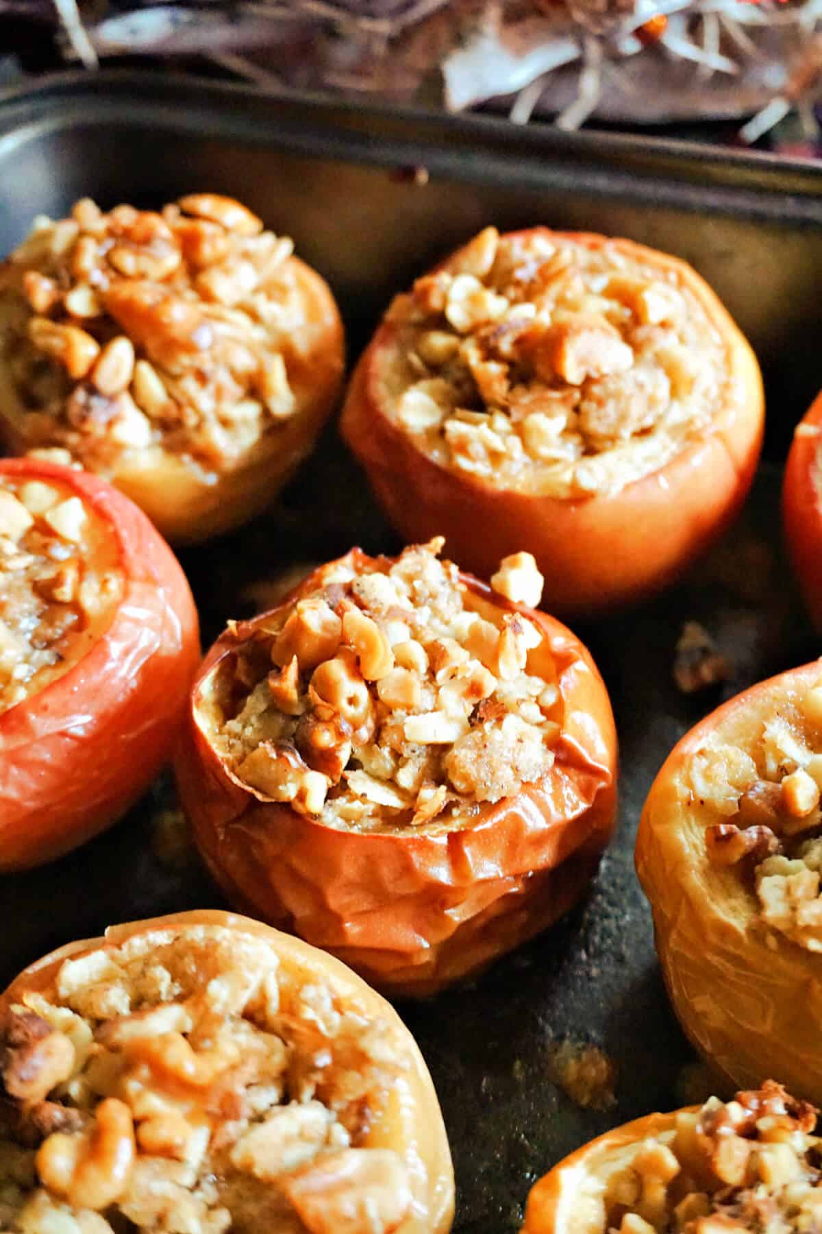 A tray with crumble stuffed apples.