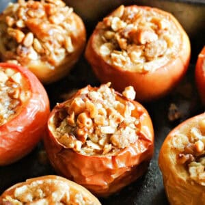 A tray with baked stuffed apples.