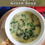 A white bowl with potato and greens soup.