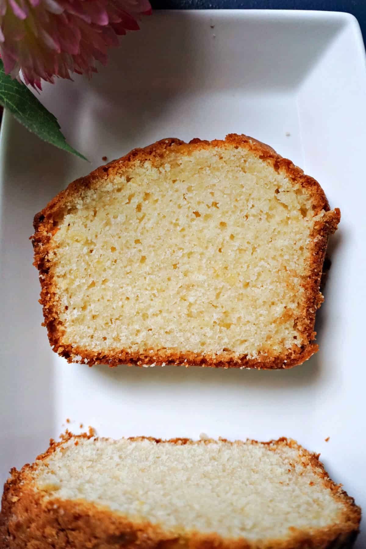 A slice of cake on a white plate.