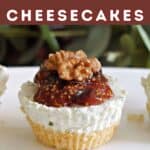 A mini cheesecake with fig jam and walnut half.