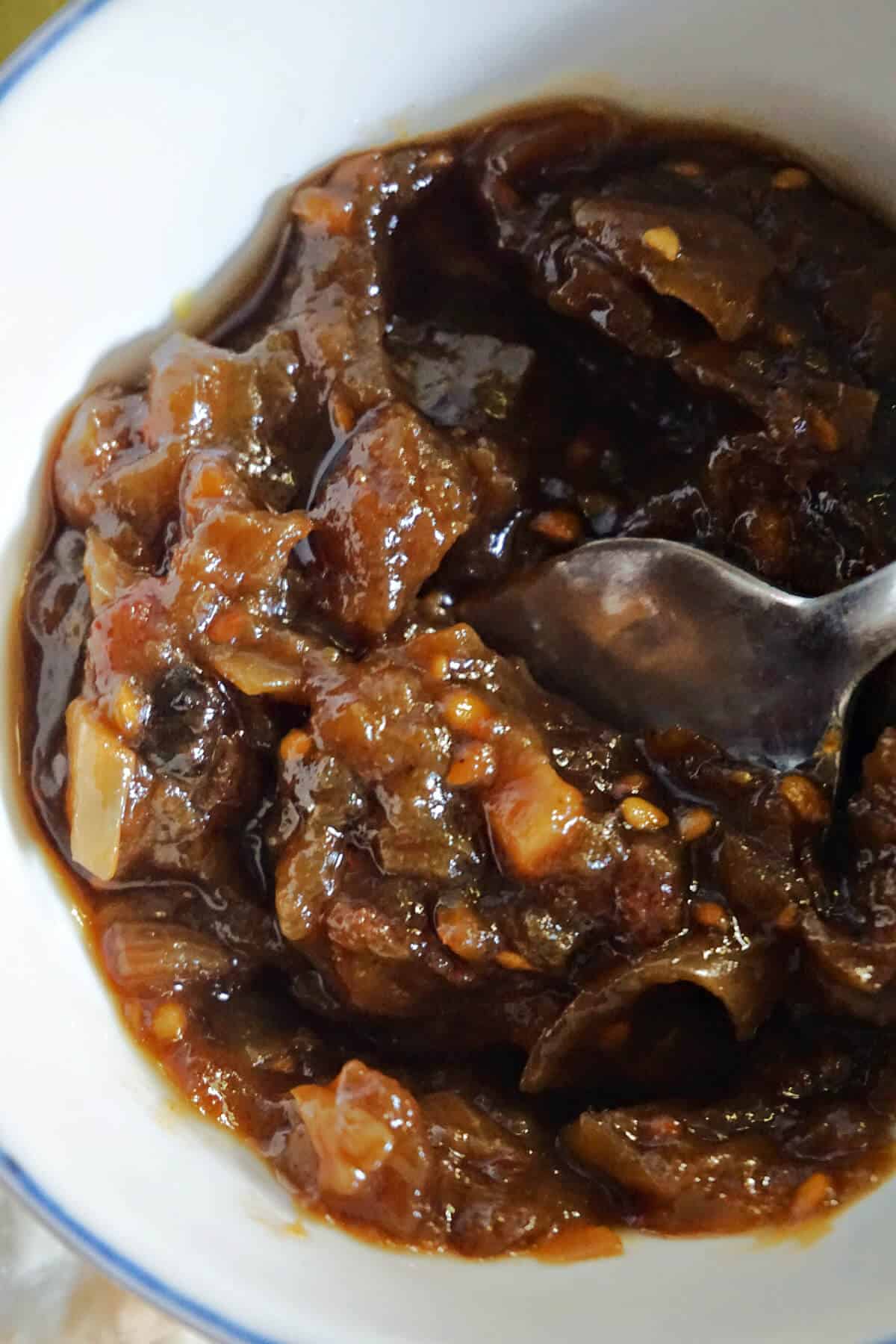A white bowl with chutney.