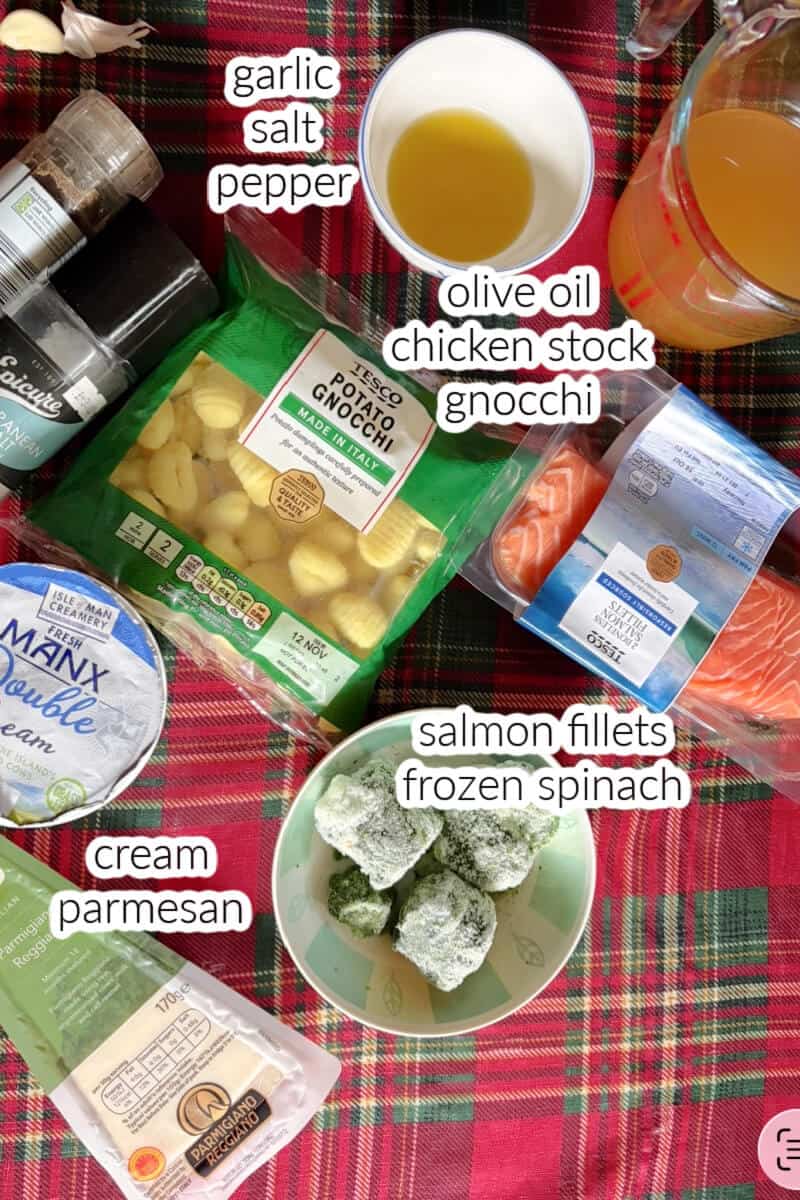 Ingredients displayed on the table for making gnocchi with spinach and salmon.